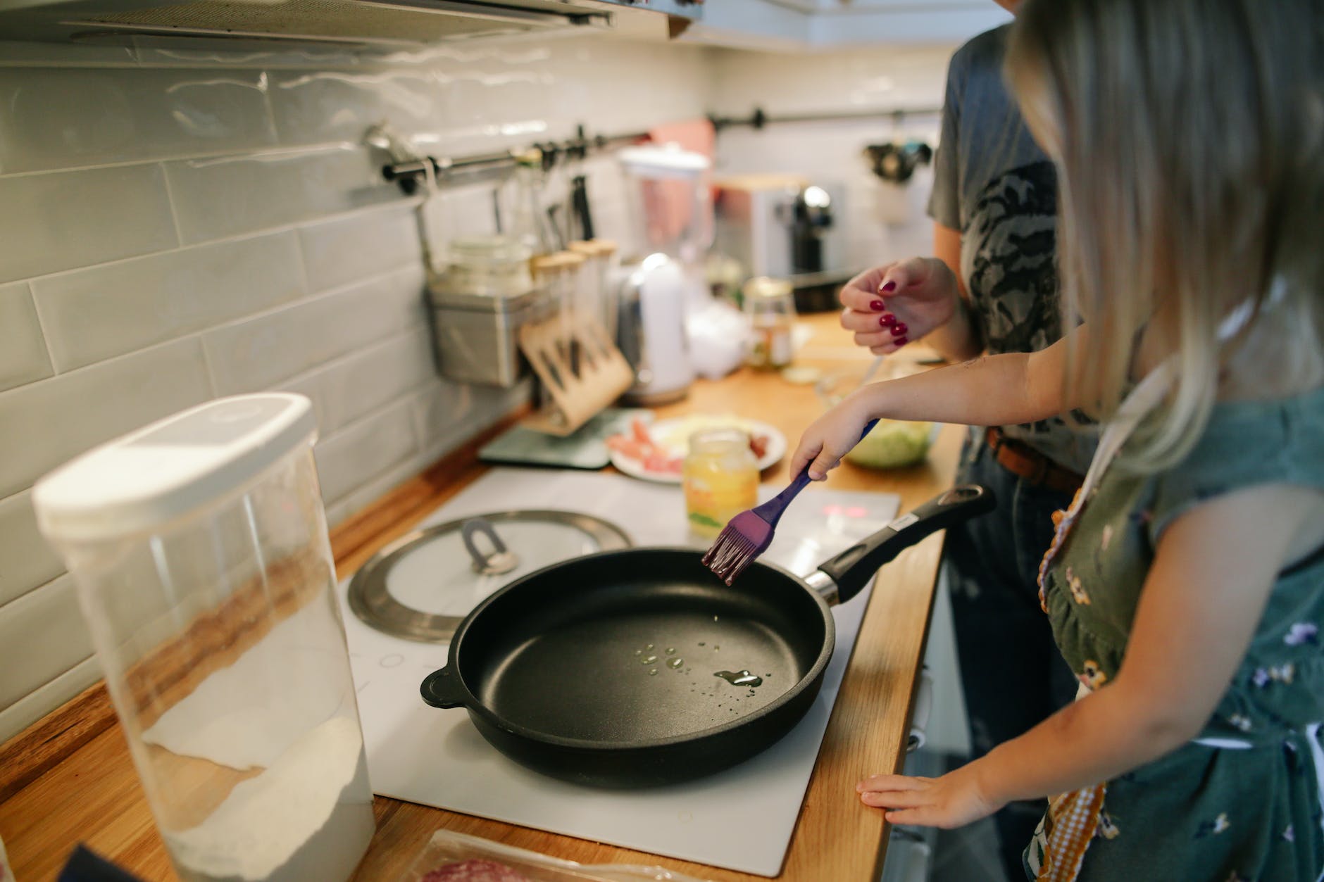 little girl cooking get your kids excited for homeschooling