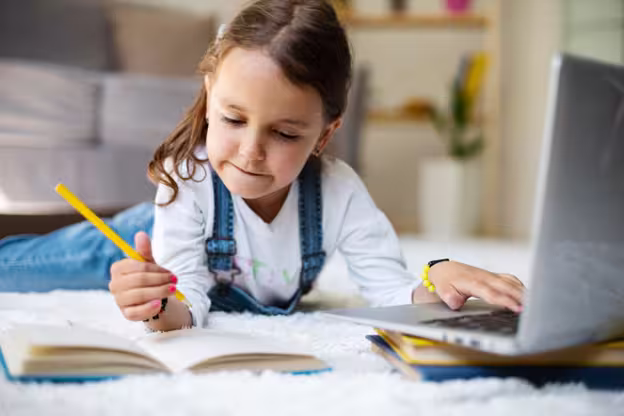 little girl focusing on schoolwork